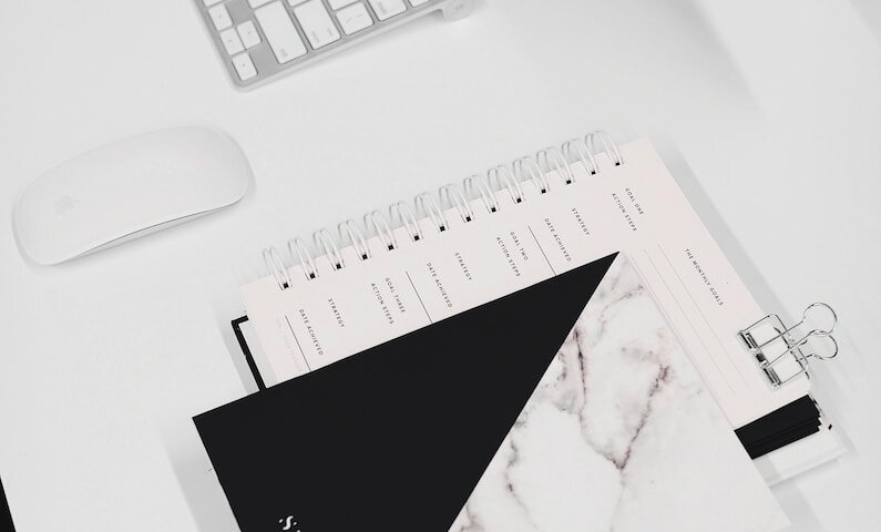 white and black notebook